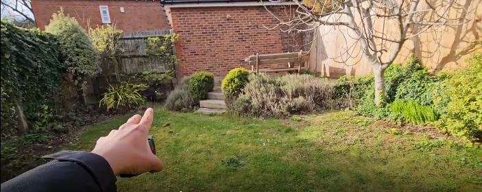 Garden in Harpenden before landscaping transformation with tired lawn and overgrown planting