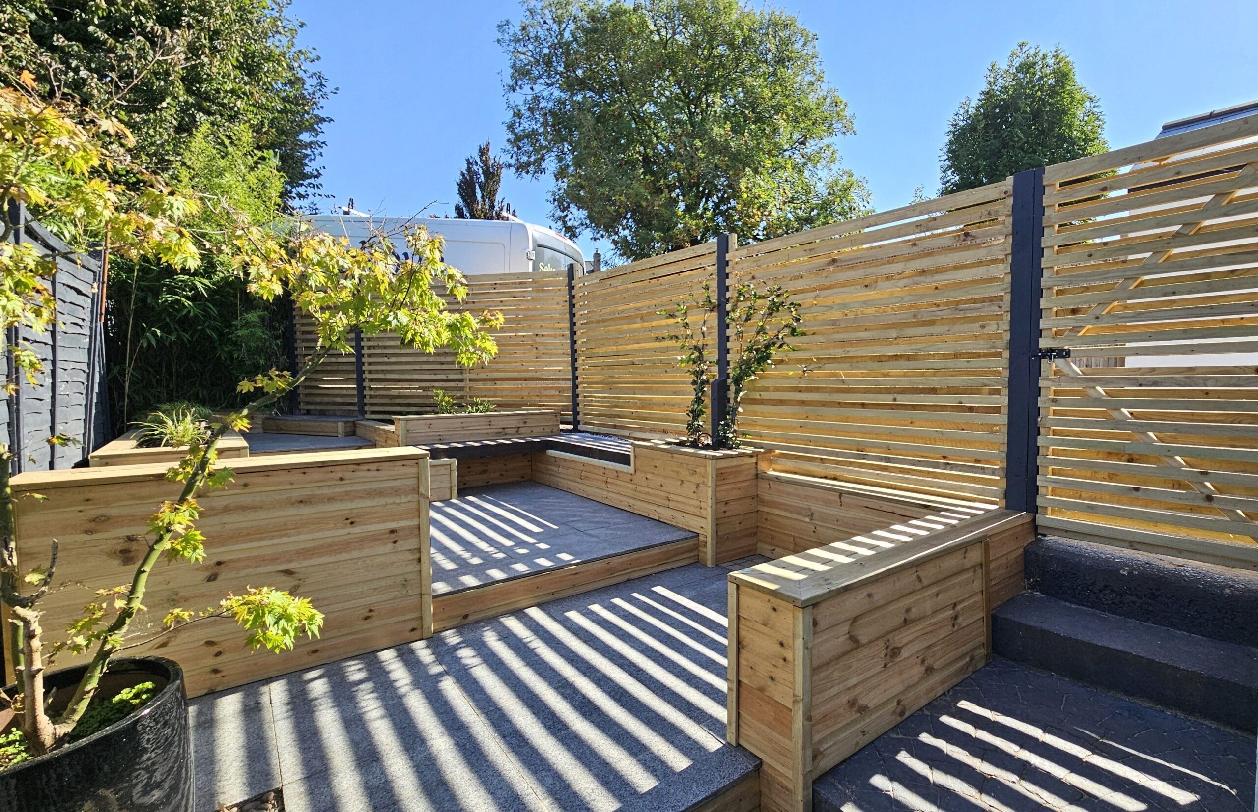 Completed garden transformation in St. Albans with timber raised planters, contemporary screening and landscape seating areas. 